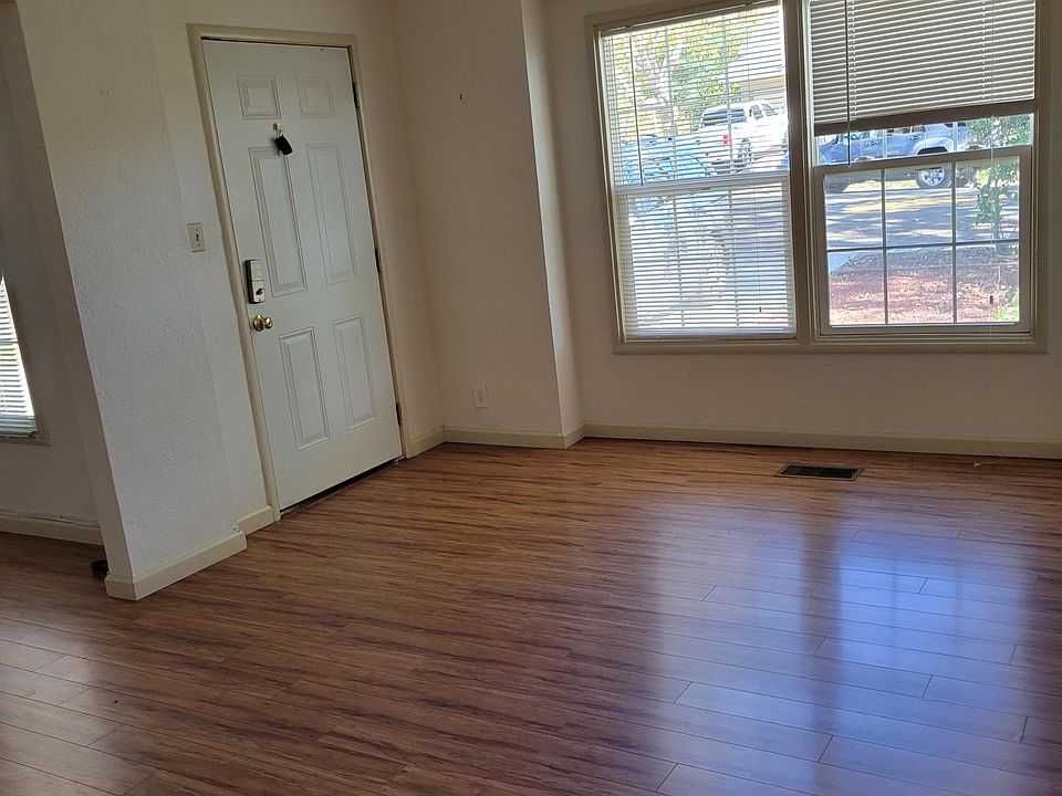 Living Room view to main entrance door and the window