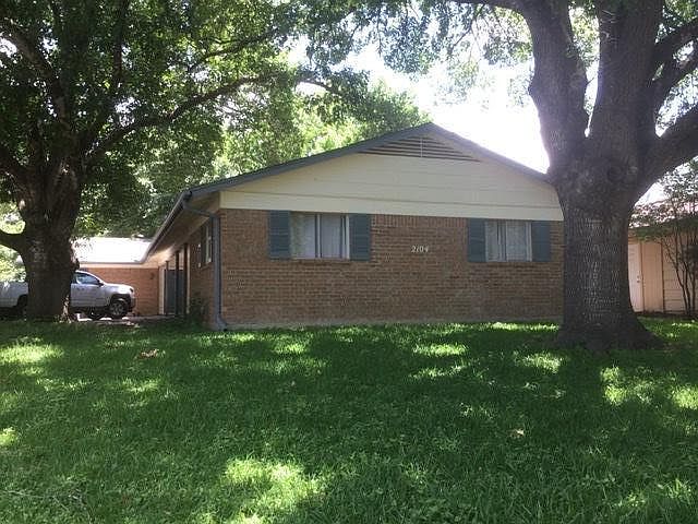 Large shaded front yard.