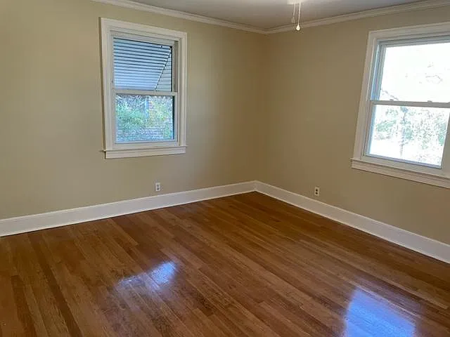 Large master bedroom. All hardwood floors have been refinished.