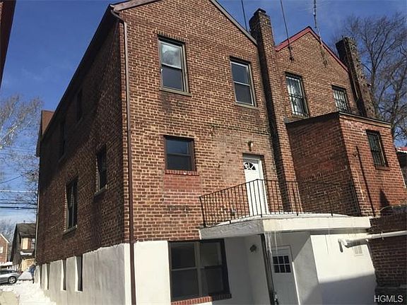 rear view/ unit 1 entrance/ back patio