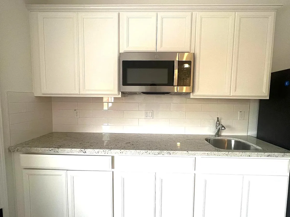 Kitchenette with a microwave. Counter-top stove will be added. - 3065 Newfoundland Dr #2