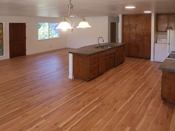 New Kitchen: New Flooring, countertop, Faucet.