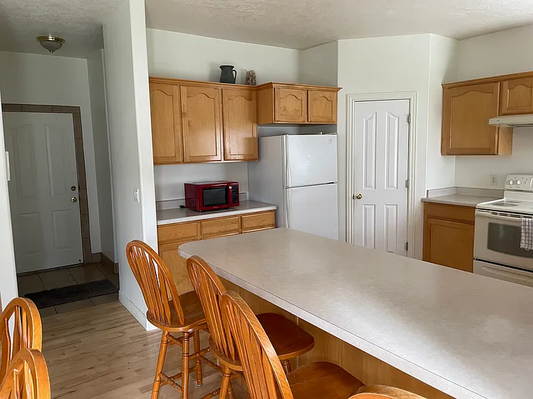kitchen, left is the door to the garage
bathroom and laundry are also down this hallway