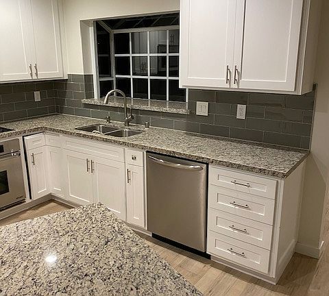 Kitchen sink wall with dishwasher