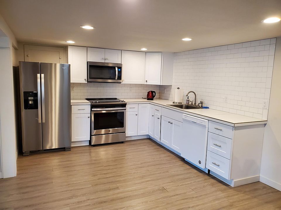 Kitchen has full size refrigerator with ice maker, microwave, stove, dishwasher