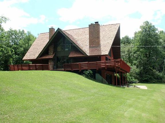 A view of the north side of the home, the kids use this hill for sledding.