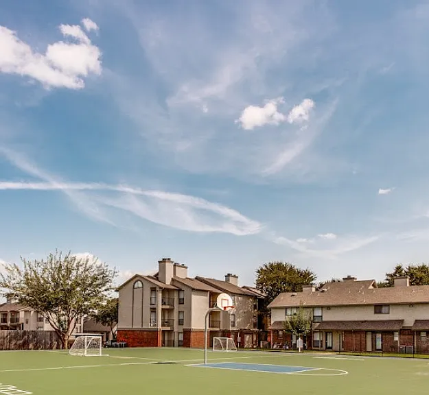 Outdoor sports court for soccer and outdoor fitness options.