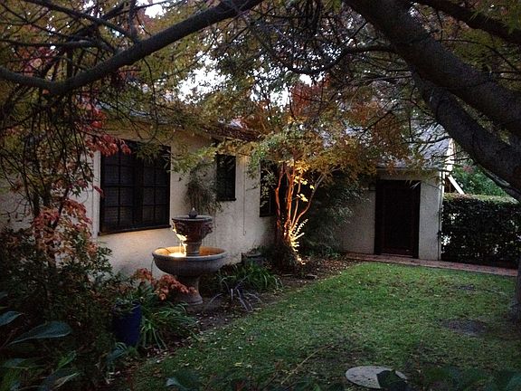 Gated and Enclosed Side-Yard Garden with Water Fountain and Large Trees