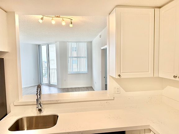 Open Window Kitchen looks out to the living/dining room