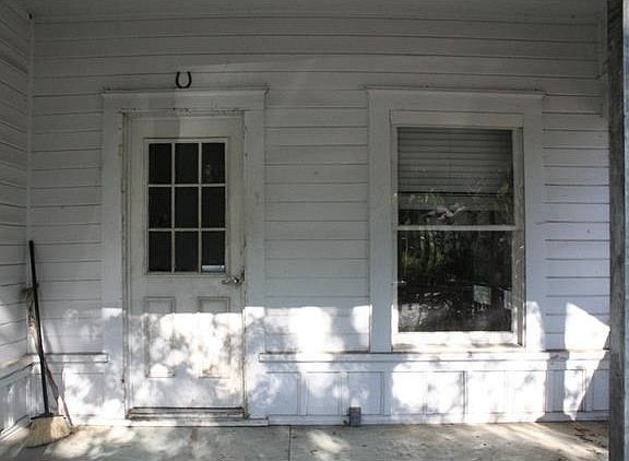 Beautiful woodwork can be seen throughout the home. Notice the classic craftsman window casings on the front porch.