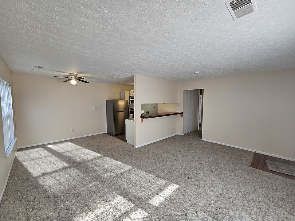 Open floor plan, freshly painted with new flooring and appliances.