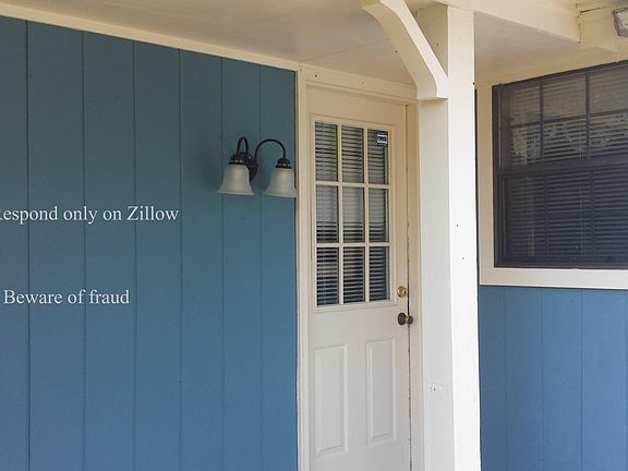 Door off driveway into kitchen