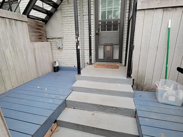 Car entrance patio. with doggie dog storm door.