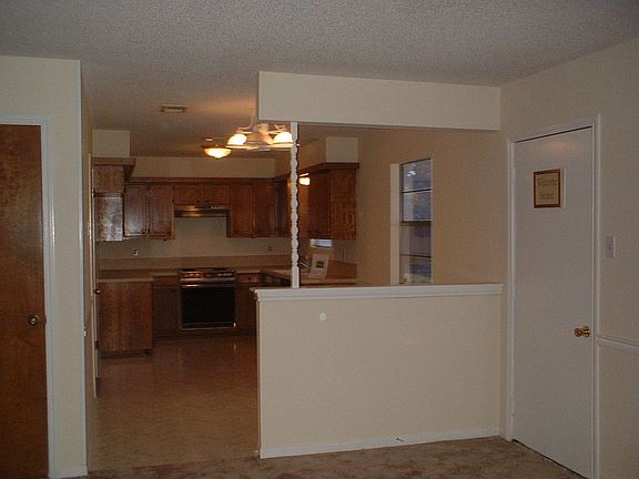 Kitchen w/dining area & back door
