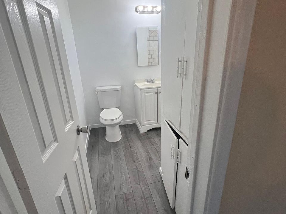 entrance to bathroom with plenty of storage