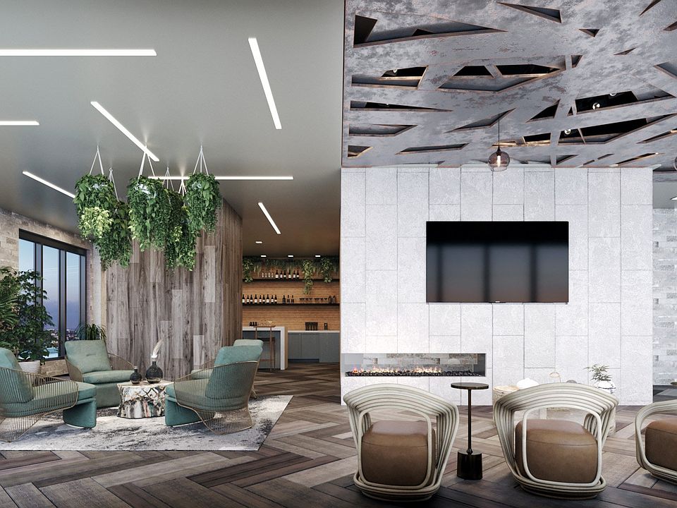 Spacious penthouse clubhouse lounge with outdoor terrace located on the rooftop.
