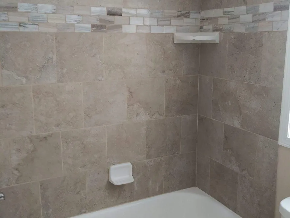 Brand new bathroom - close up of the beautiful new tub and tile tub surround!