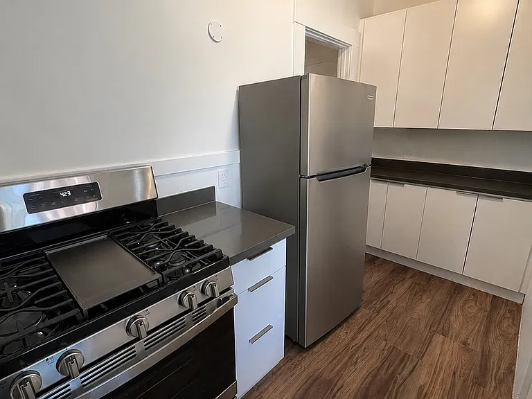 New refrigerator as well. Cabinets along one entire wall.
