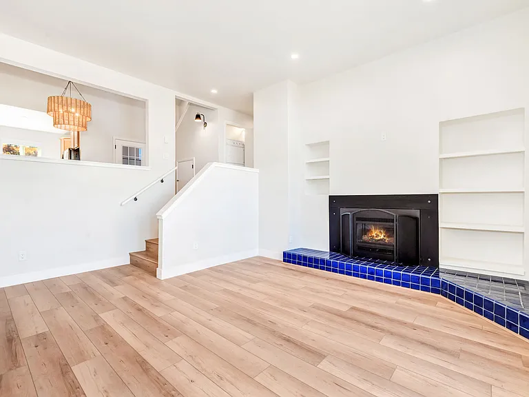 Living room with gas fireplace and walk out to back deck.