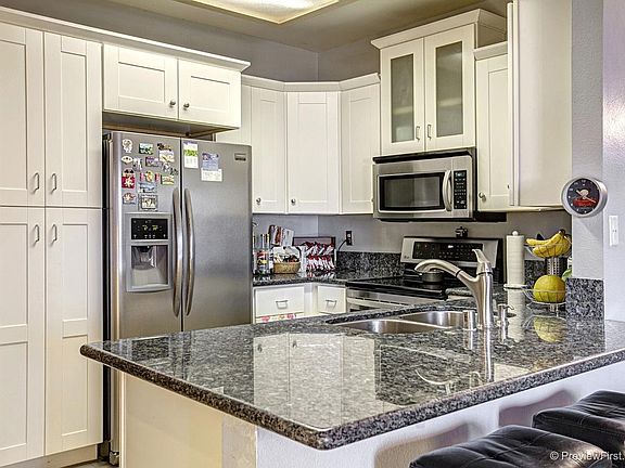 Totally updated kitchen with high end cabinets, granite tops and high end appliances.