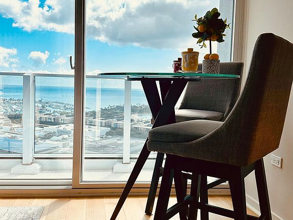 The breakfast / coffee area with ocean+city view