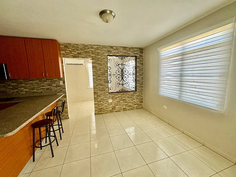 Kitchen, dining room and designated office space all with air conditioner.