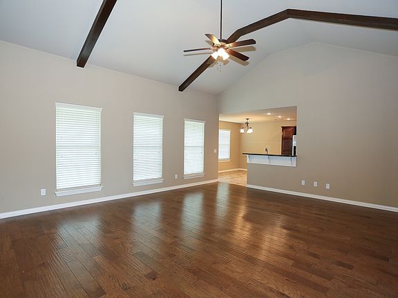 Bright and open floor plan with high beamed ceilings