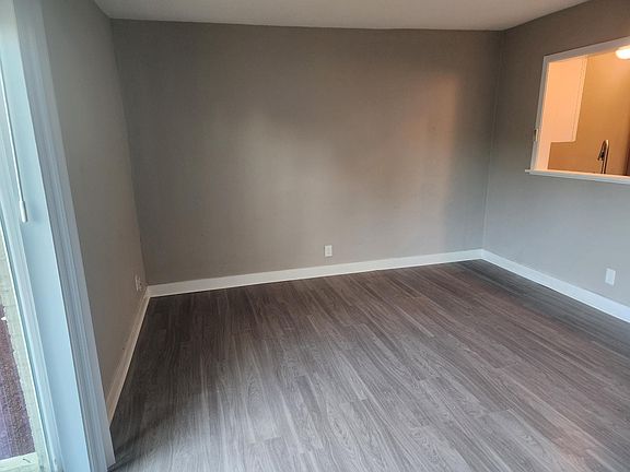 living room and window into the kitchen