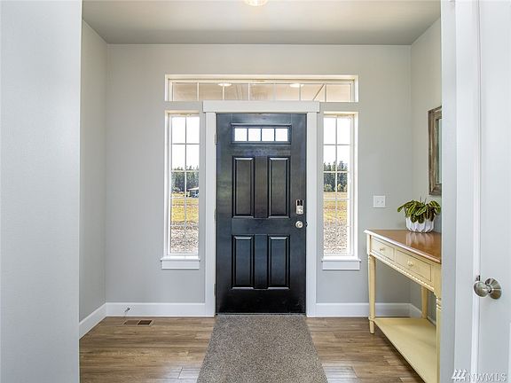 Spacious & practical front entry. Coat Closet here & a great shoe spot. Abundant storage in this home!