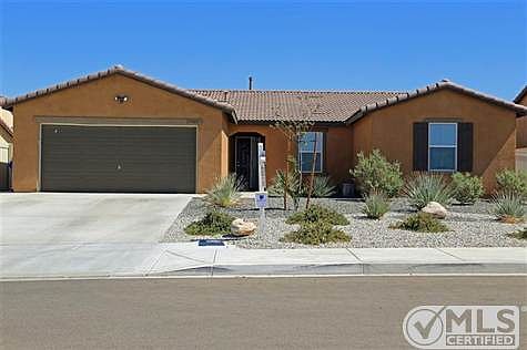 Welcome home! Fully landscaped front yard with sprinkler system.