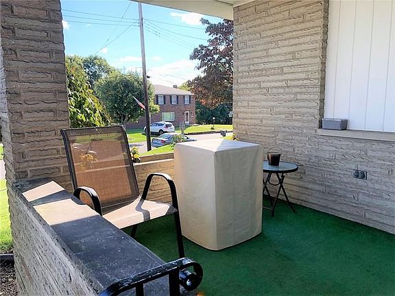 Covered Porch. Enjoy neighborhood sites and sounds as you sit and relax on the covered front porch.