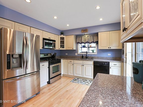 Updated Maple and Granite kitchen with Stainless Steele Appliances.
