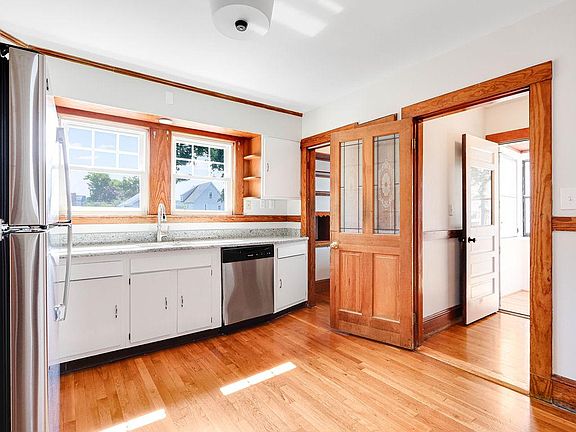 Kitchen toward pantry/laundry & stairs to upper floor