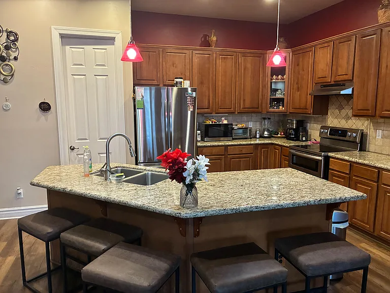 Full kitchen with island and a walk in pantry