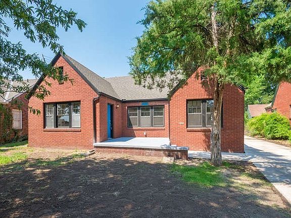 House has a front porch with 2 doors on each side. One door goes to living room the other the breakfast nook. Both doors are brand new and have new hardware. Exterior lighting is new. Surface on porch is new. Driveway is new.