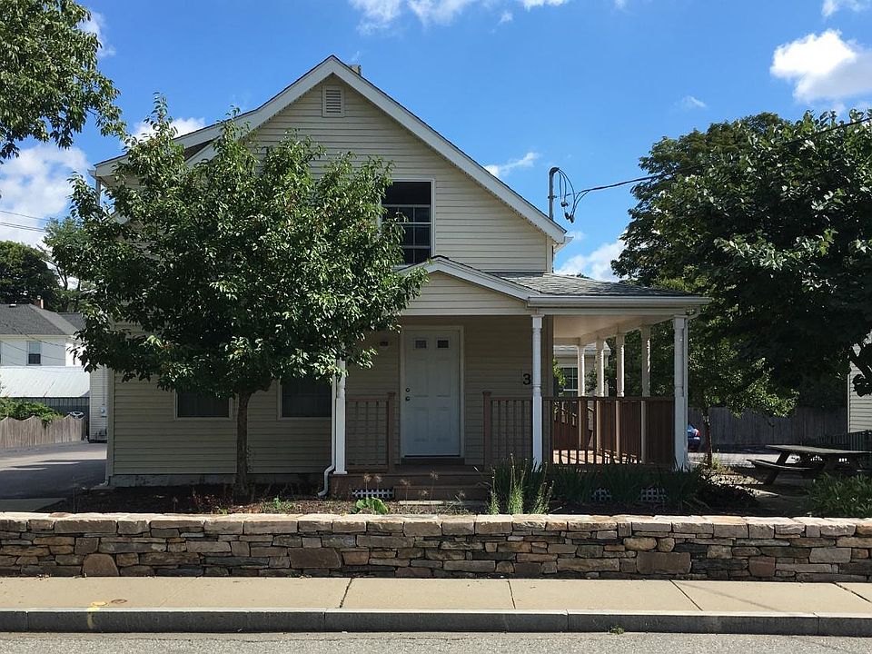 Exterior front, 2nd floor unit, driveway is to the left of the home and offers off-street parking