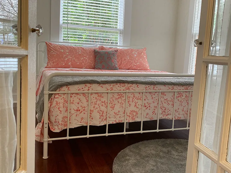 Downstairs bedroom from hall near bathroom.