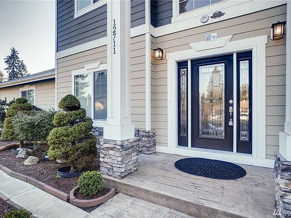 A grand soaring covered entry with stone accented pillars welcome you to this stunning custom built home that shows great pride of ownership. Grounds are immaculately maintained with maple, bonsai and palm trees.