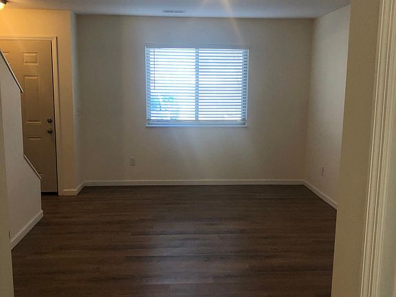 MAIN FLOOR LIVING ROOM, STORAGE CLOSET UNDER STAIRS