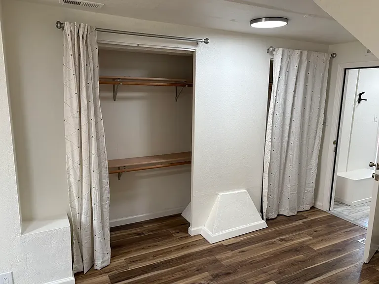 Ground level bedroom with closets