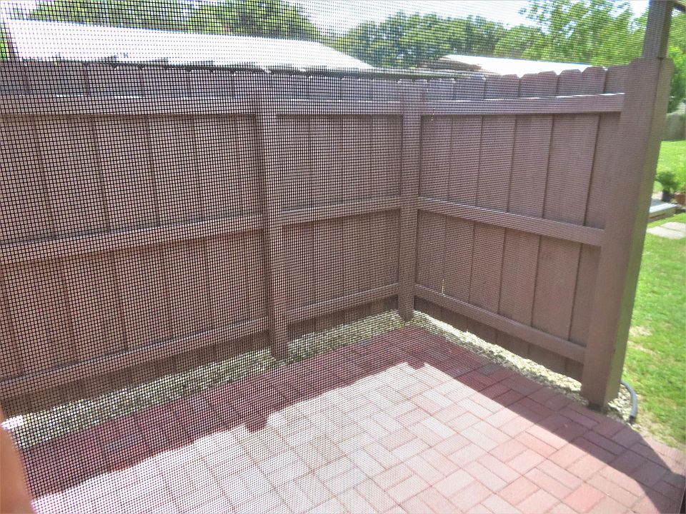 Privacy fenced adjoining open patio.