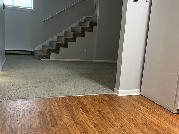 View from kitchen. Main/Living room to the right. Entry steps in the far distance.