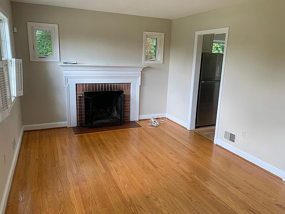Living room with wood burning fireplace