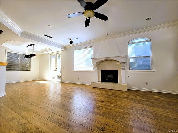 Oversized great room with fireplace and french doors leading to a private yard