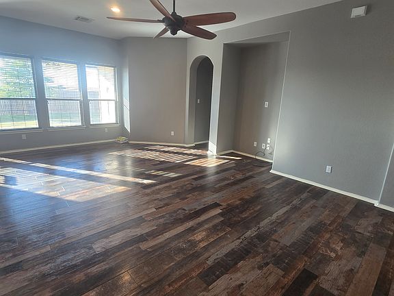 living room with extra large fan