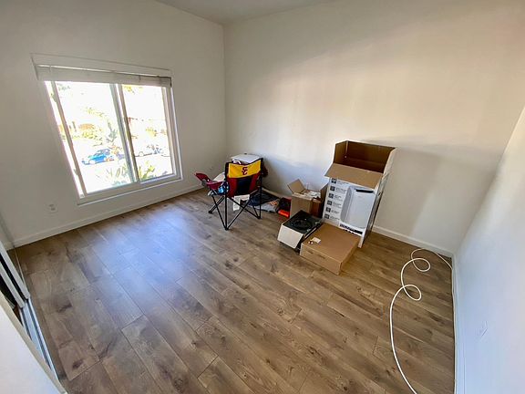 Secondary bedroom (west facing) with large mirrored closet