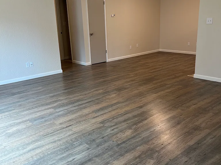 Family room looking into dining area with coat closet