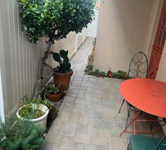 private side entrance and first floor patio with bbq