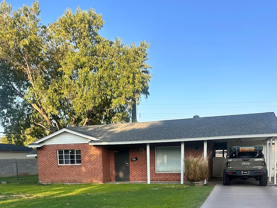 Cute and charming red brick home, front