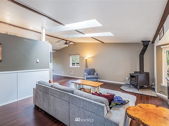 Enter into Living Room - Light & Bright!  Attractive Beadboard Wainscot & Skylights!